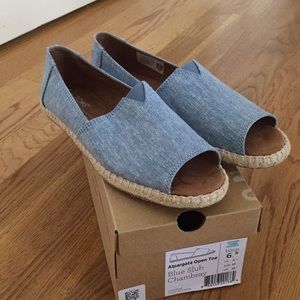 Brand new Toms open toe shoes.